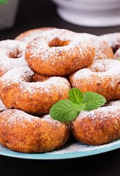 Brunch or lunch. Homemade donuts sprinkled with powdered sugar.
